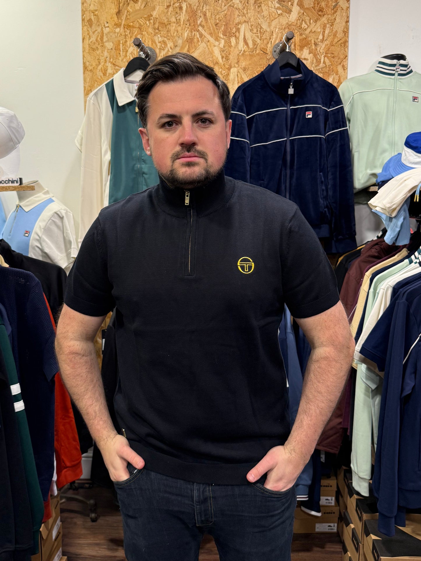 Black Sergio Tacchini Daytone knitted polo shirt, men's casual short-sleeve shirt with collar and button placket.