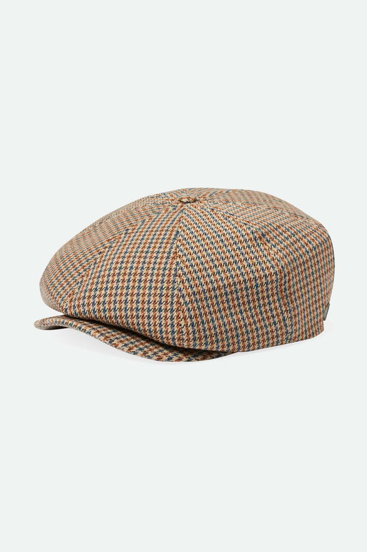 The Brood Snap Cap is one of our flagship silhouettes featuring a short front brim and custom liner. Refined with signature Brixton fabrics and a metal crest pin, you can bring storied style to everyday with this statement maker.