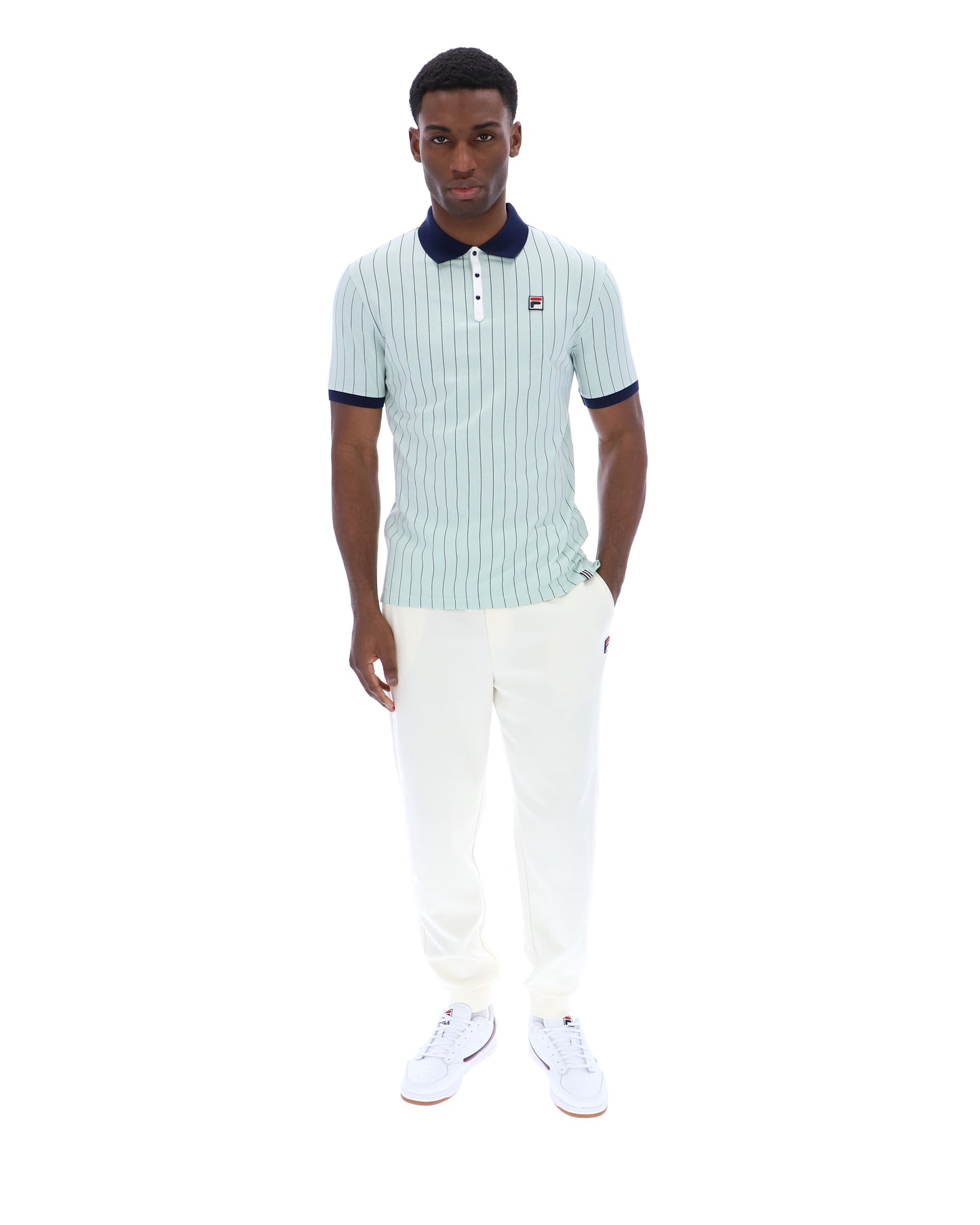 Fila Vintage BB1 Polo Shirt in Surf Spray, Navy, and White, featuring a classic collar and polo design, displayed on a flat lay.