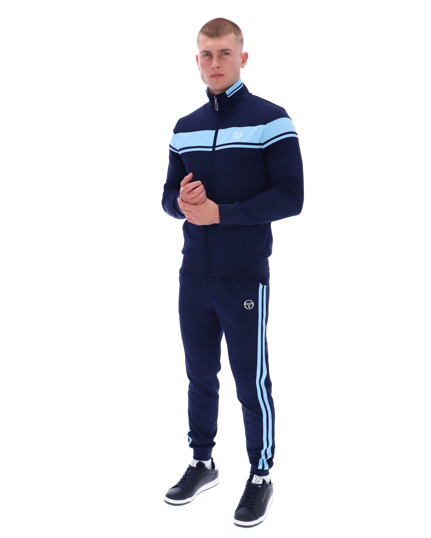 Navy and Baltic Sea Sergio Tacchini Damarindo track top with zip-up front and sporty design, shown on a hanger.