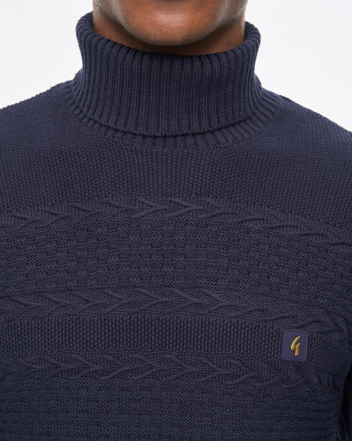Gabicci Vintage Emilio navy long sleeve roll neck knit jumper, soft fabric, fitted style, close-up of the textured knit pattern.