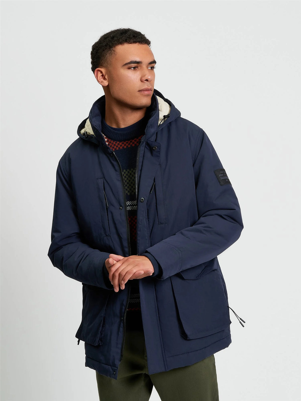 Ben Sherman Heavy Parka jacket in dark navy, featuring a warm, insulated design with a hood and front pockets.