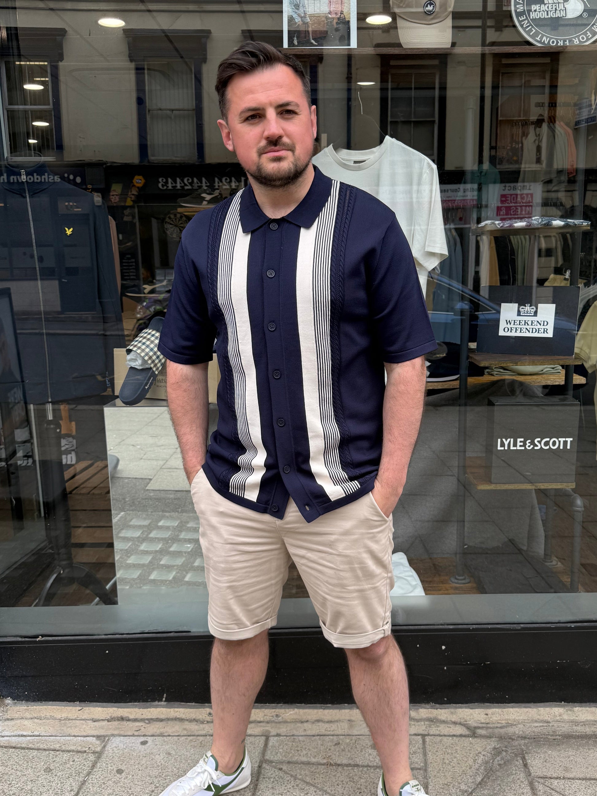 Arthur & Russell navy knitted polo shirt with stripe pattern, button-through knitwear for a classic, stylish look.