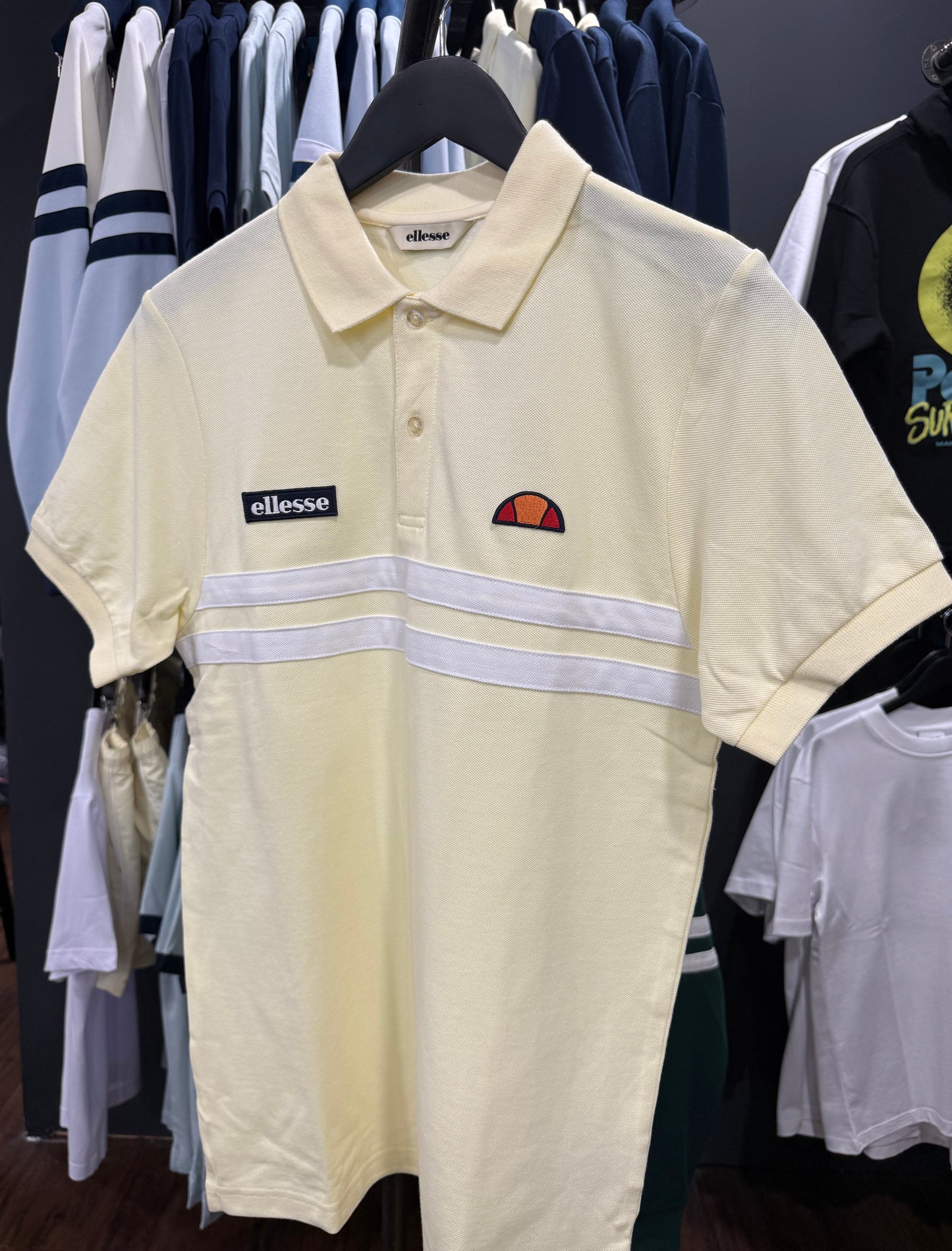 Ellesse Muccia light yellow polo shirt with classic collar and short sleeves, casual men's clothing.
