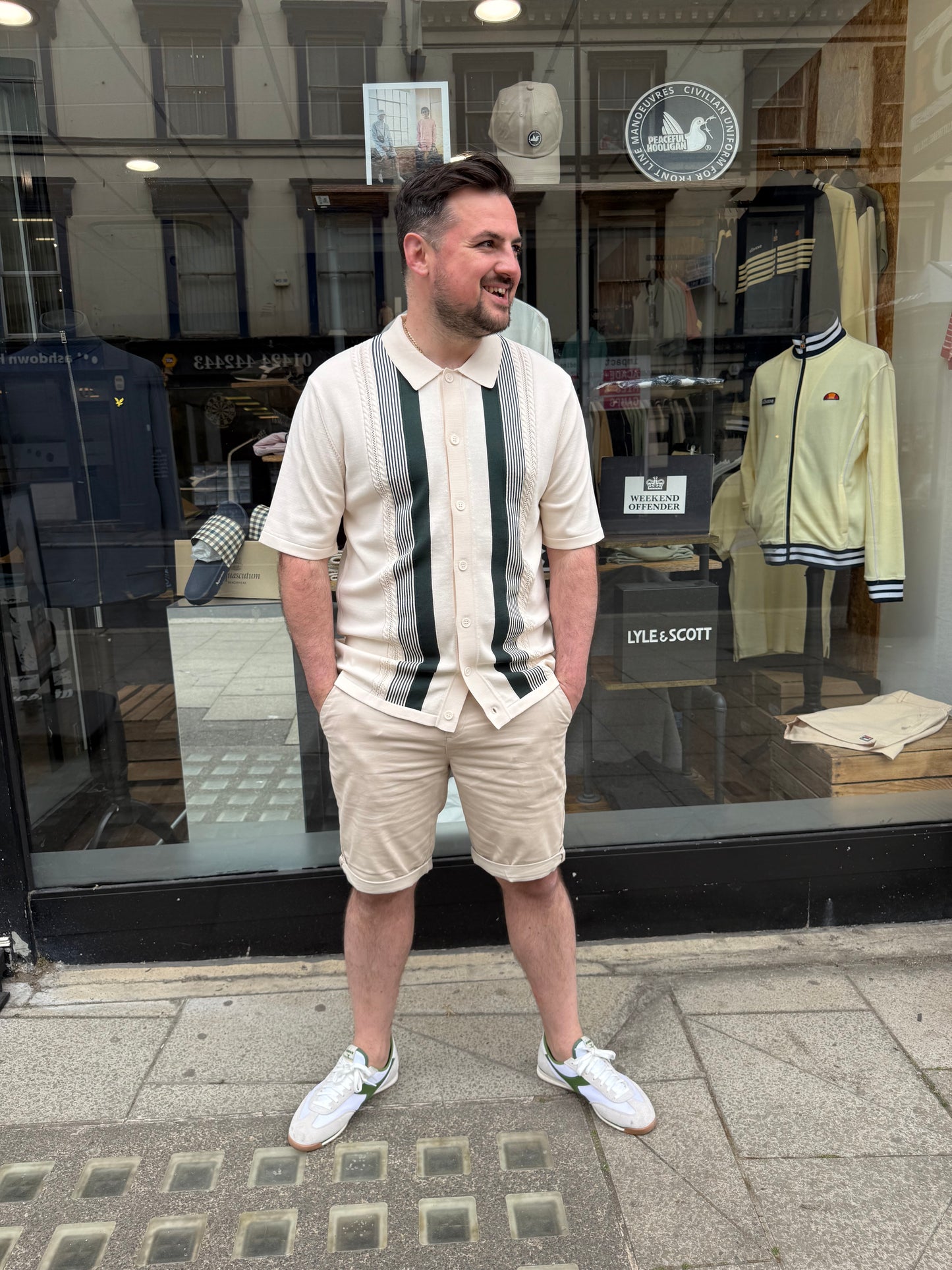 Arthur & Russell knitted stripe button-through polo shirt in ivory, featuring a classic knitwear design and striped pattern.