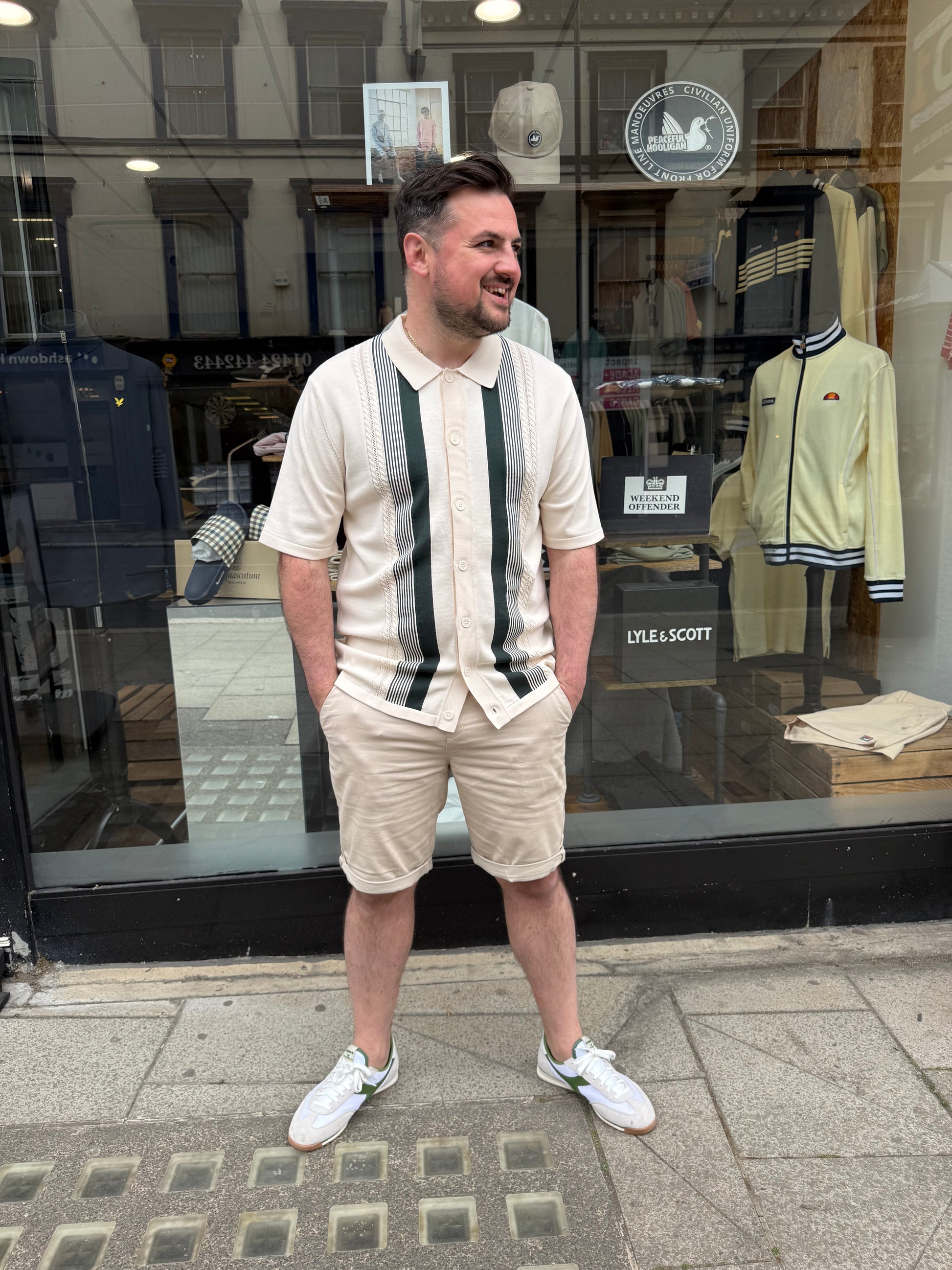 Arthur & Russell knitted stripe button-through polo shirt in ivory, featuring a classic knitwear design and striped pattern.