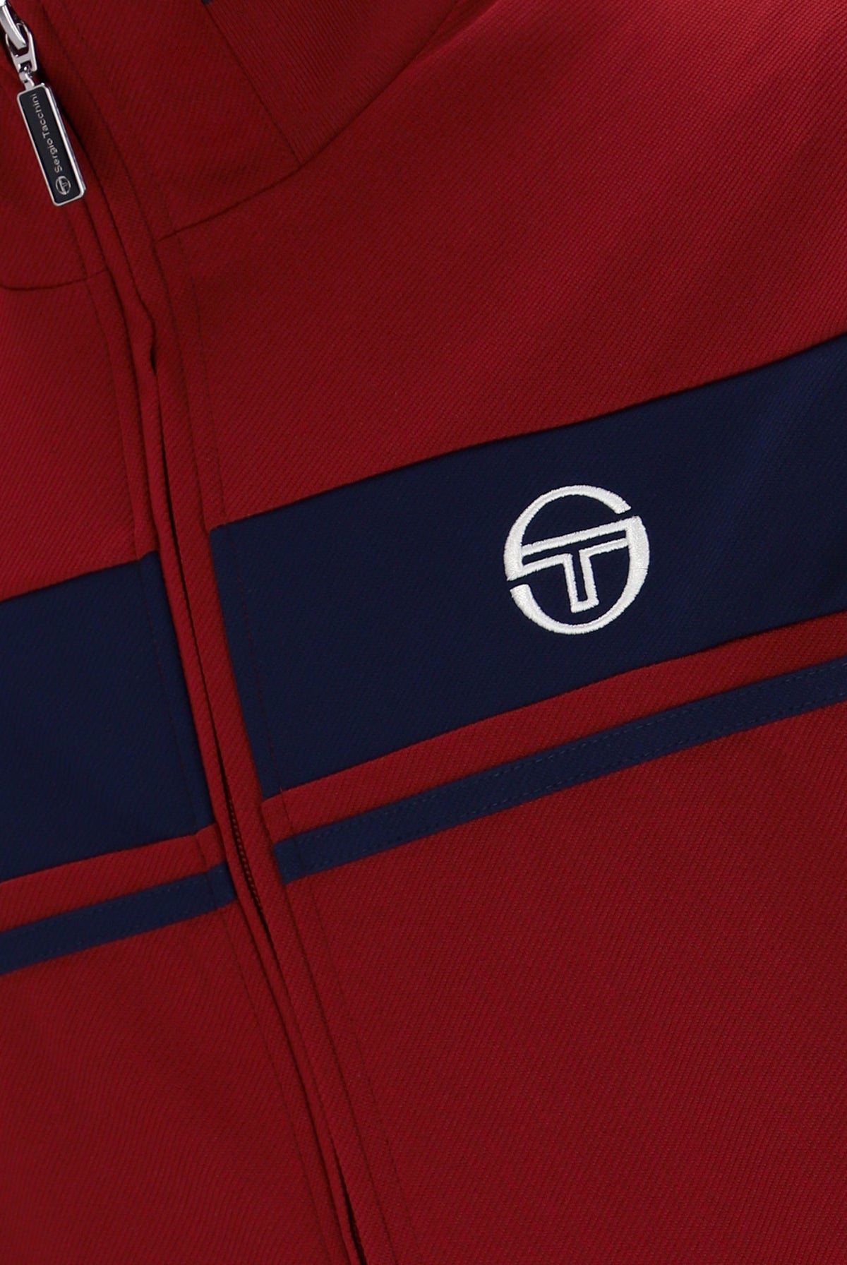 Sergio Tacchini Damarindo track top in Merlot and Maritime Blue, featuring a sporty design with full zipper and logo details.