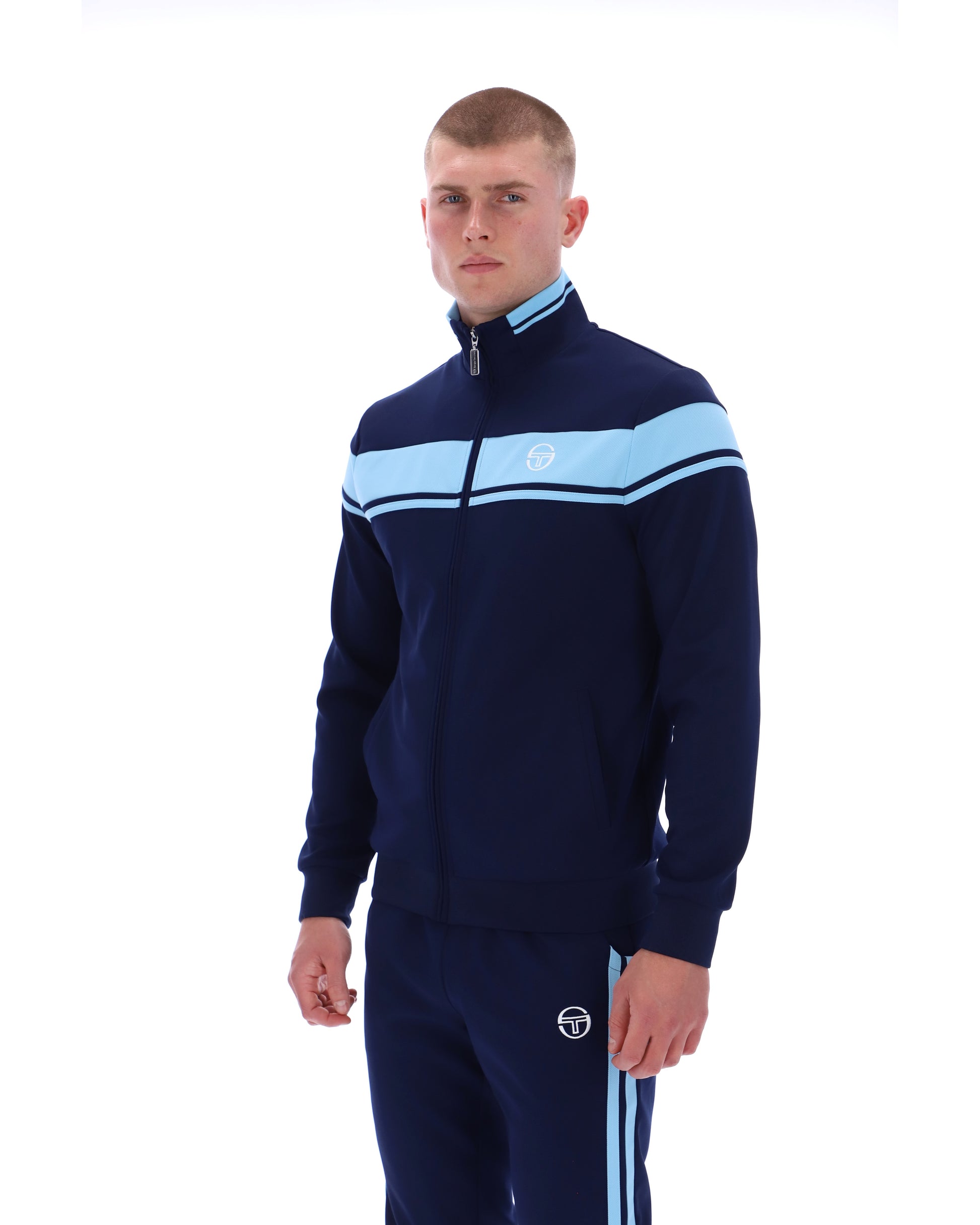 Navy and Baltic Sea Sergio Tacchini Damarindo Track Top with sporty design and zip-up front, shown on a hanger.