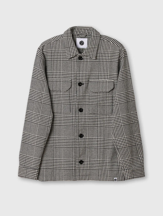 Black Pretty Green Alderley Prince of Wales jacket with tailored fit and classic design, shown on a hanger.