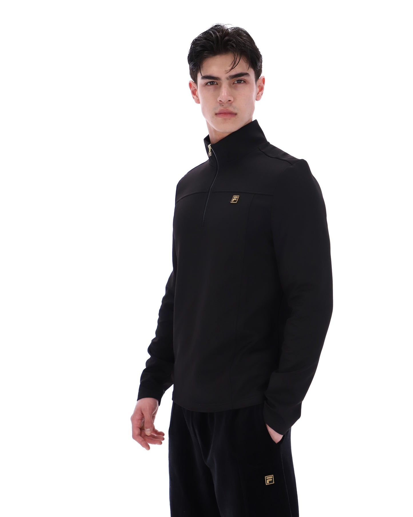 Black Fila Hogan quarter zip jumper, stylish men's sweater with a high collar and Fila branding, shown on a neutral background.