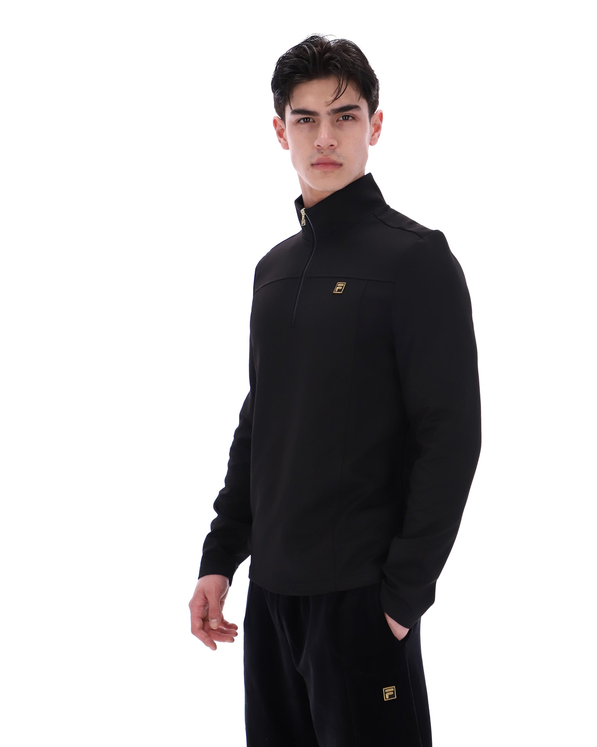 Black Fila Hogan quarter zip jumper, stylish men's sweater with a high collar and Fila branding, shown on a neutral background.