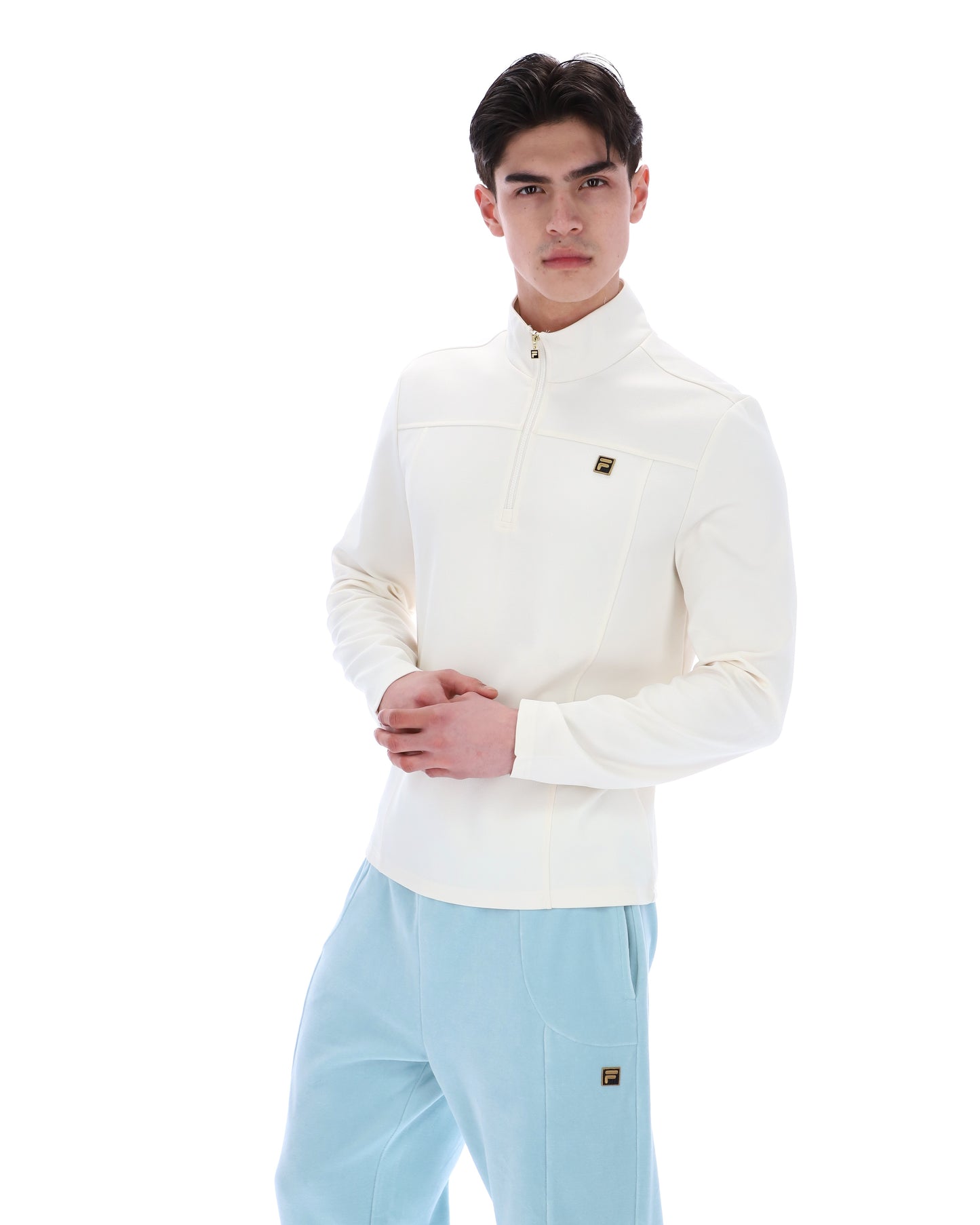 Fila Gold Hogan quarter zip jumper in coconut milk color, featuring a cozy knit design and the brand logo on the chest.