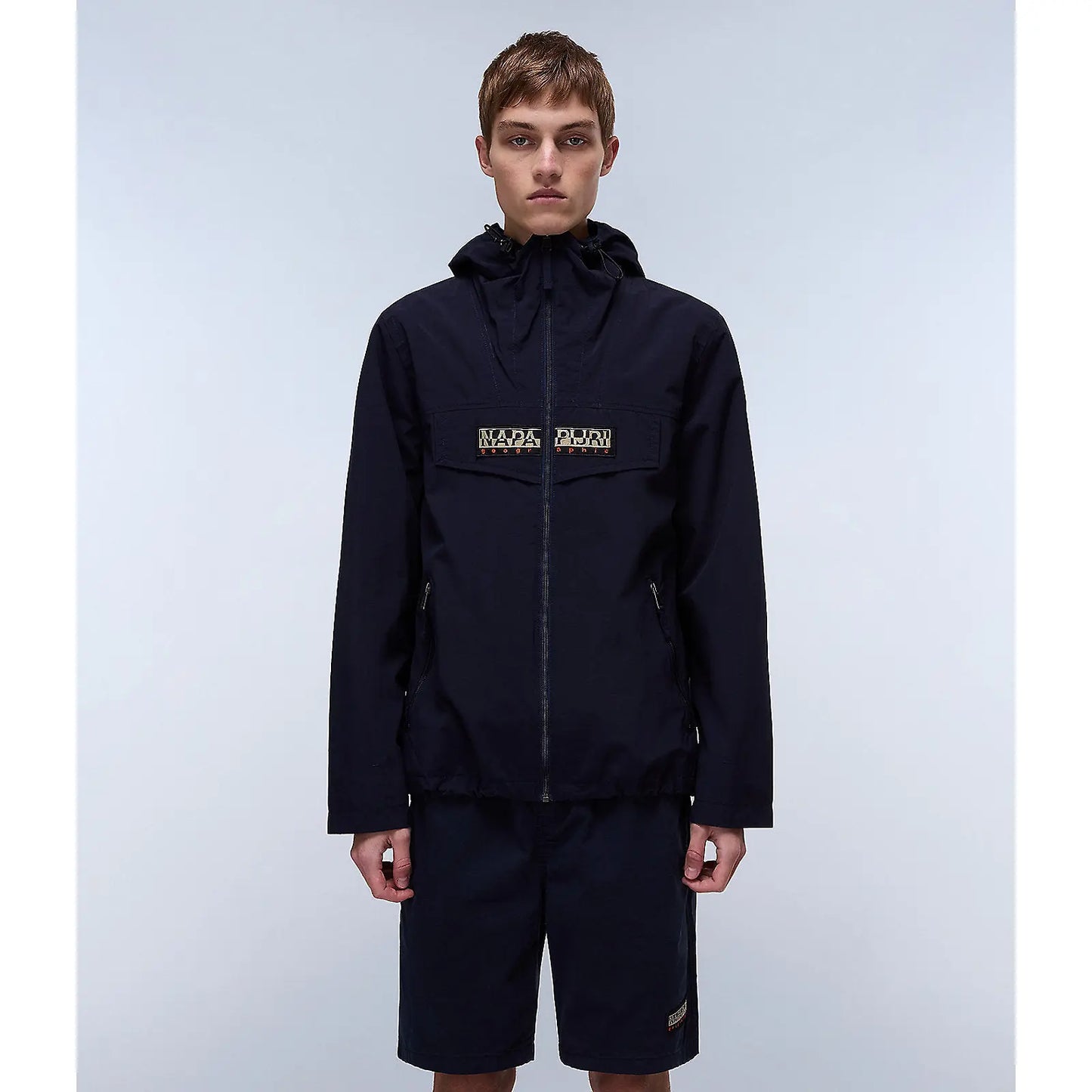 Napapijri Rainforest open Blu Marine jacket with hood, waterproof outdoor apparel, featuring a blue and green color design.
