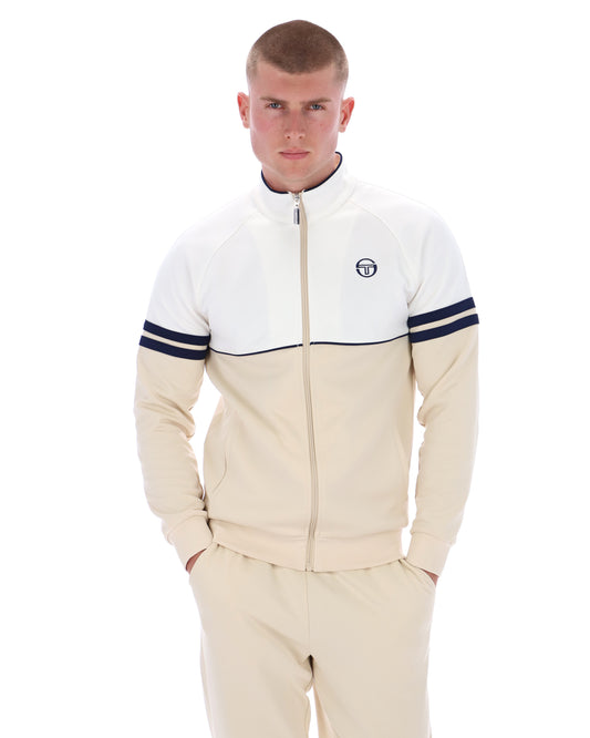 Sergio Tacchini Orion track top in gardenia, sandshell, and maritime blue, shown on a hanger with front view and zip closure.