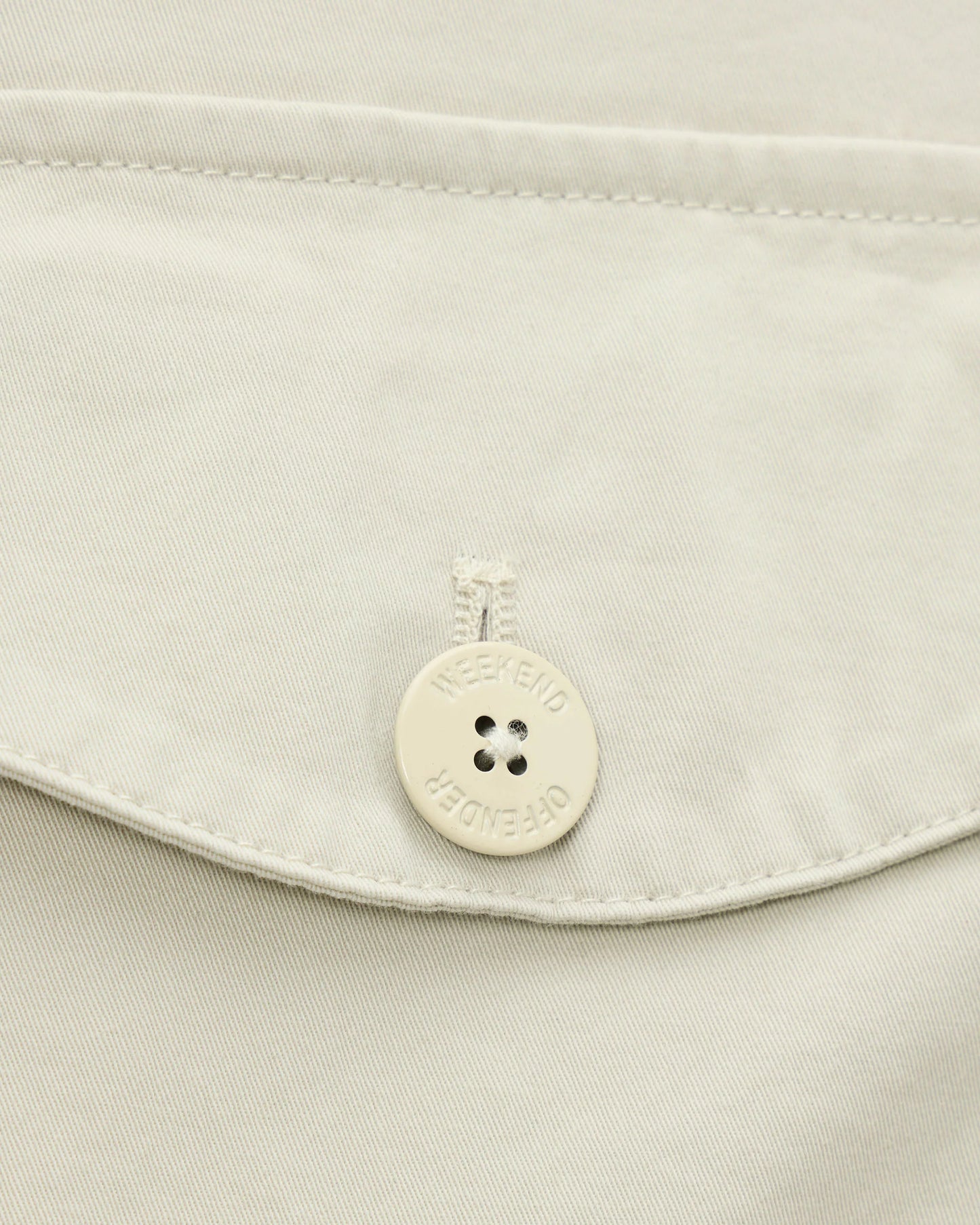 Weekend Offender Kovags Over-Top jacket in cement color, featuring a casual fit and durable fabric, displayed on a hanger.