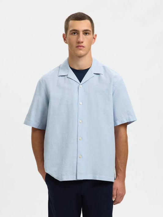 Selected Homme blue linen blend short sleeve shirt with a relaxed fit and button-front design, perfect for casual wear.