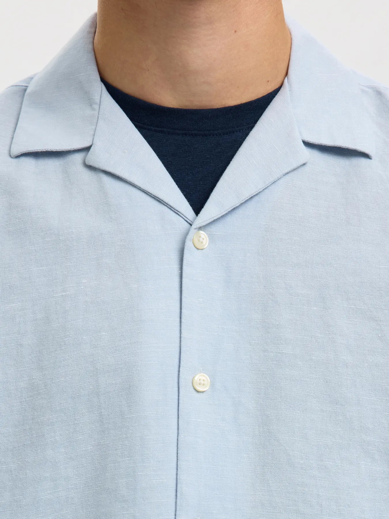 Selected Homme SlhrlXClay linen blend short sleeve shirt in dusty blue, shown on a model with a casual fit and button-front design.
