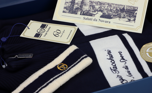 Sergio Tacchini 60th Anniversary Track Top in maritime blue and gardenia, featuring sporty design and logo on the front.