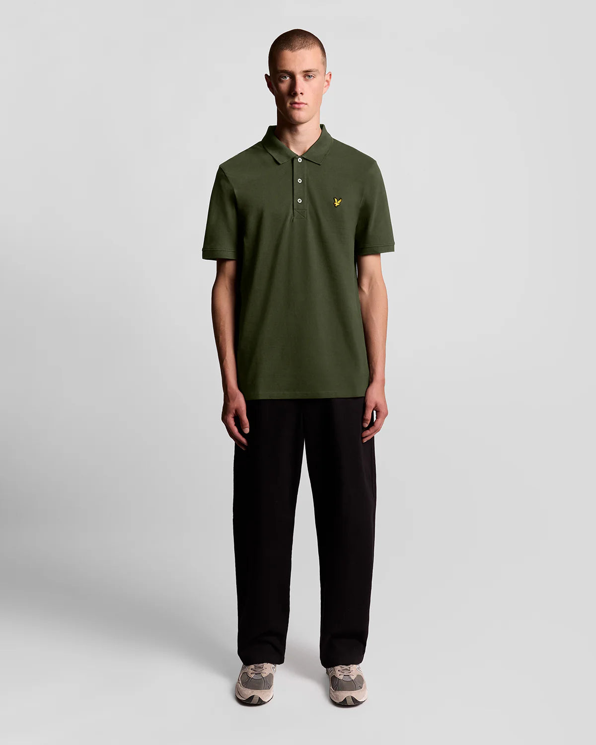 Lyle & Scott cotton polo shirt in olive green, featuring a classic collar and the iconic eagle logo on the chest.