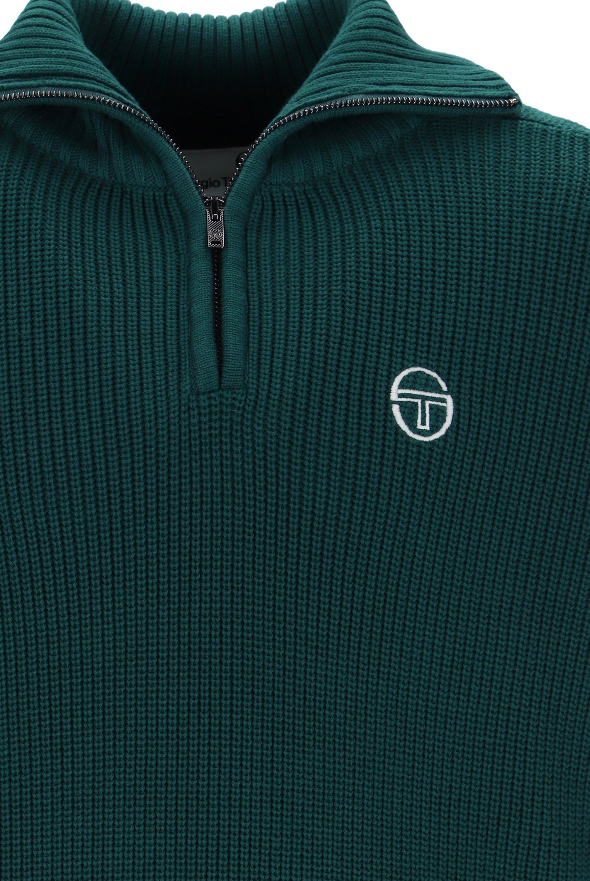 Deep teal and gardenia Sergio Tacchini Toledo quarter zip jumper displayed on a hanger, showcasing its color and fabric texture.