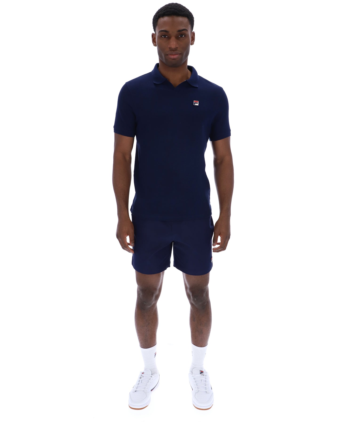 Navy Fila Tristiano polo shirt with a classic collar and short sleeves, displayed on a flat surface.