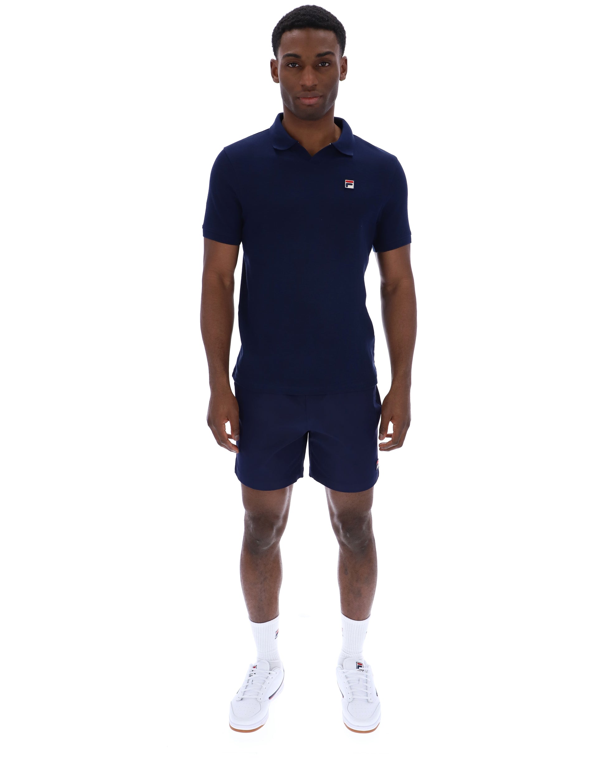 Navy Fila Tristiano polo shirt with a classic collar and short sleeves, displayed on a flat surface.