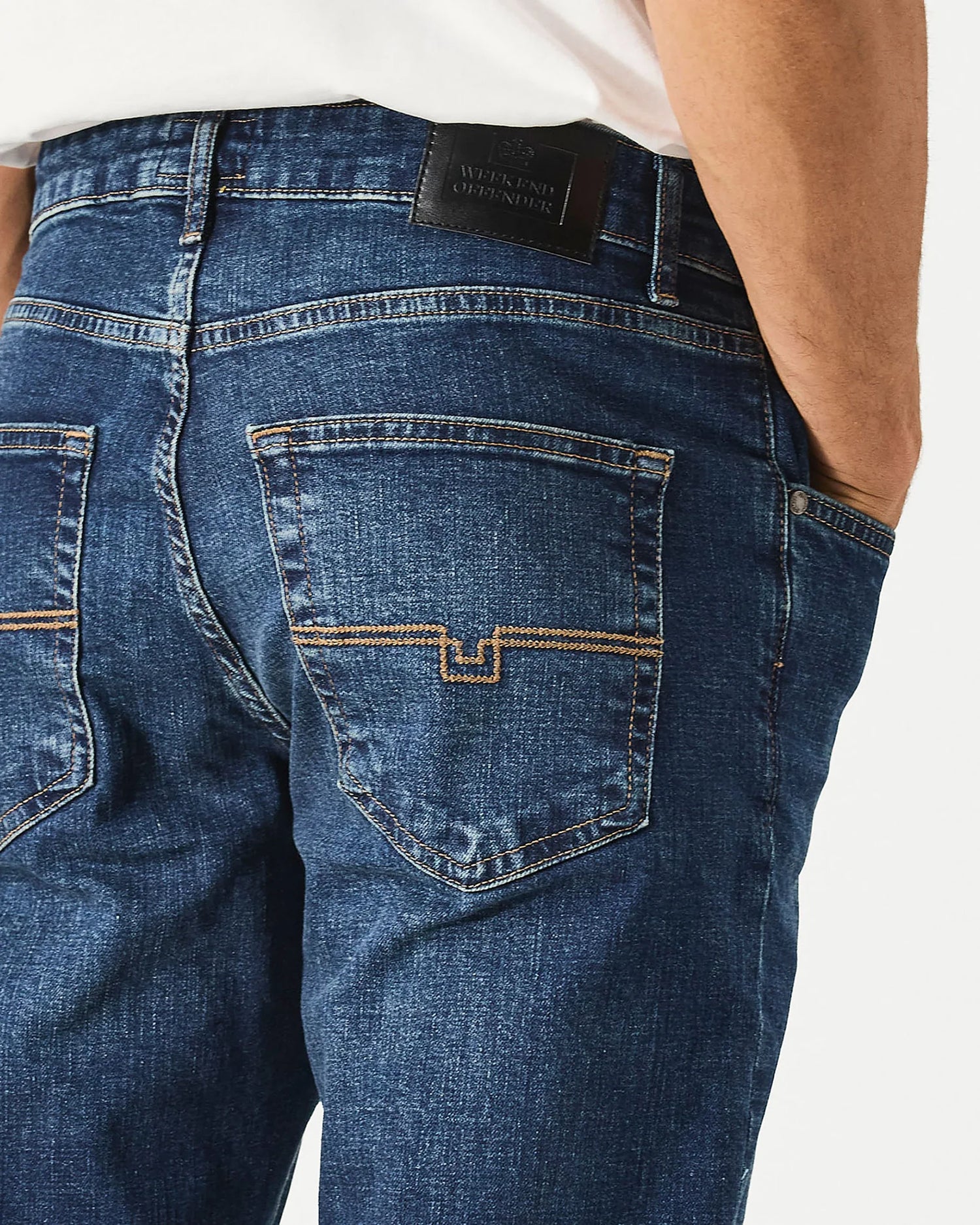 Dark vintage tapered fit denim jeans by Weekend Offender, showing classic five-pocket style and detailed stitching.