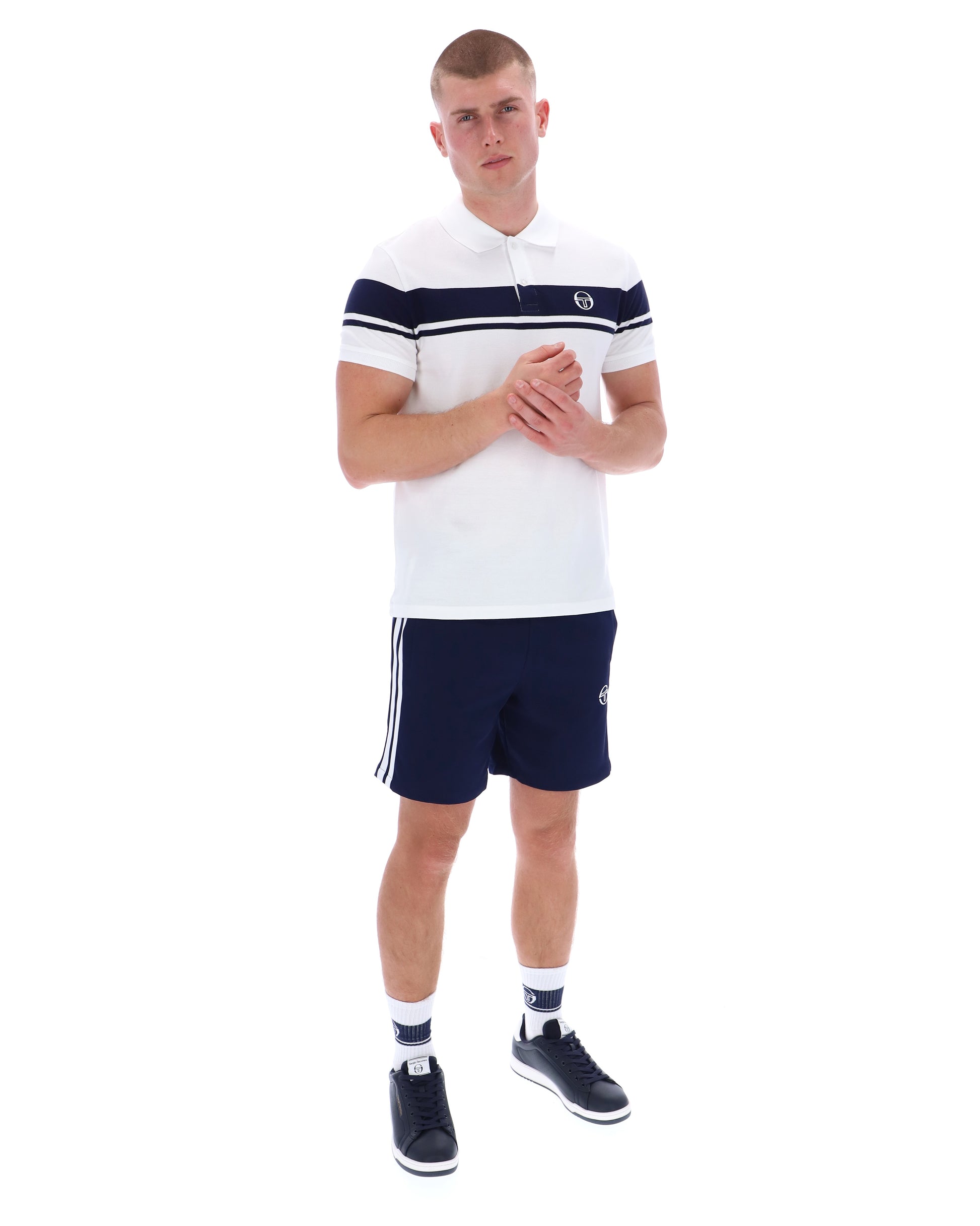 White and navy Sergio Tacchini Young Line polo shirt with a classic collar and logo detail, displayed flat on a white background.