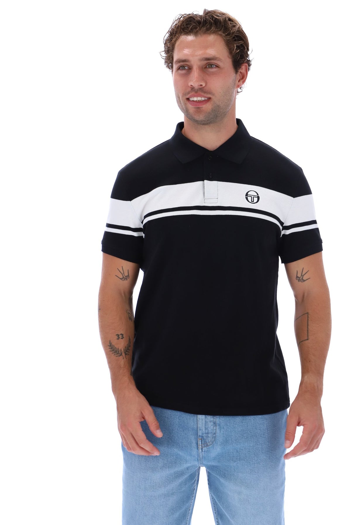 Black and white Sergio Tacchini Young Line polo shirt displayed on a hanger with the brand logo visible.