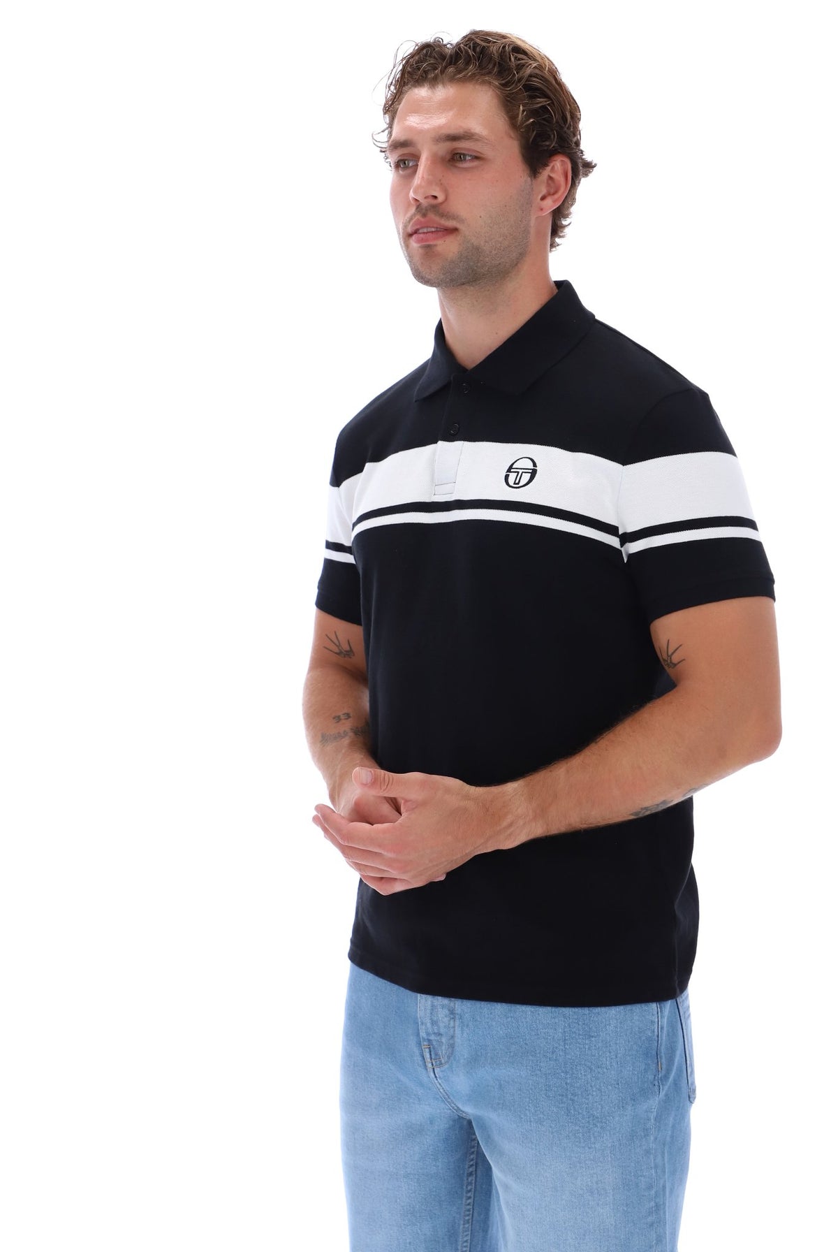 Black and white Sergio Tacchini Young Line polo shirt with classic design and logo details.