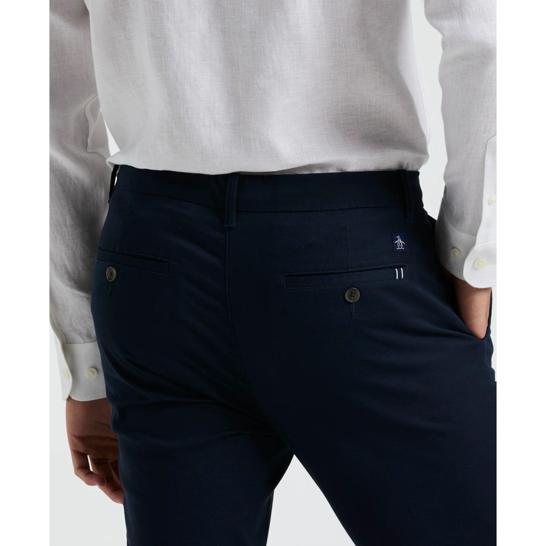 Original Penguin slim fit chinos in dark sapphire, men's trousers with a tailored fit, showcasing front and side view on a white background.