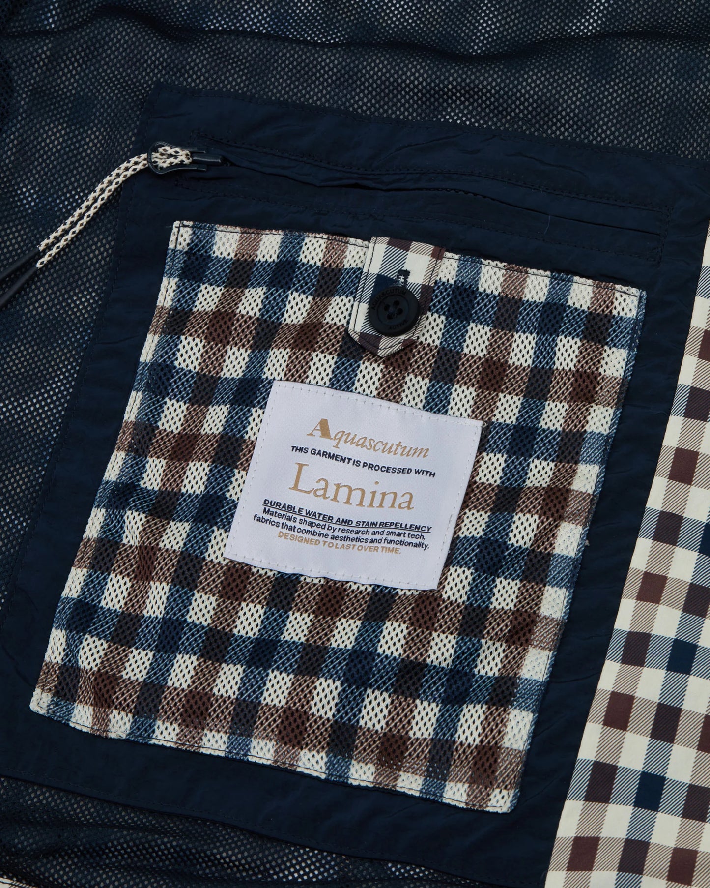 Aquascutum Lamina hooded jacket featuring a classic club check pattern, lightweight fabric, and a stylish hooded design.