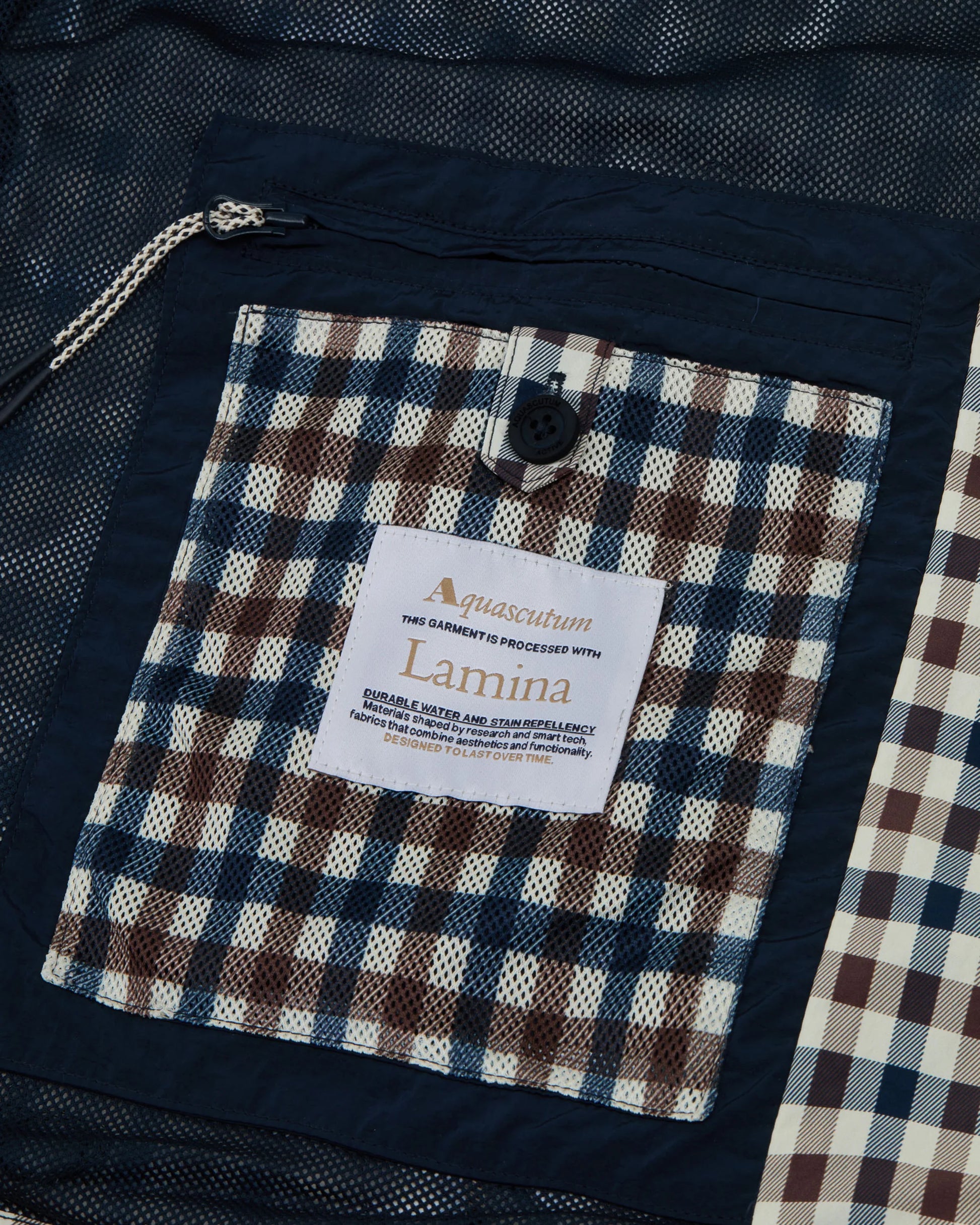 Aquascutum Lamina hooded jacket featuring a classic club check pattern, lightweight fabric, and a stylish hooded design.
