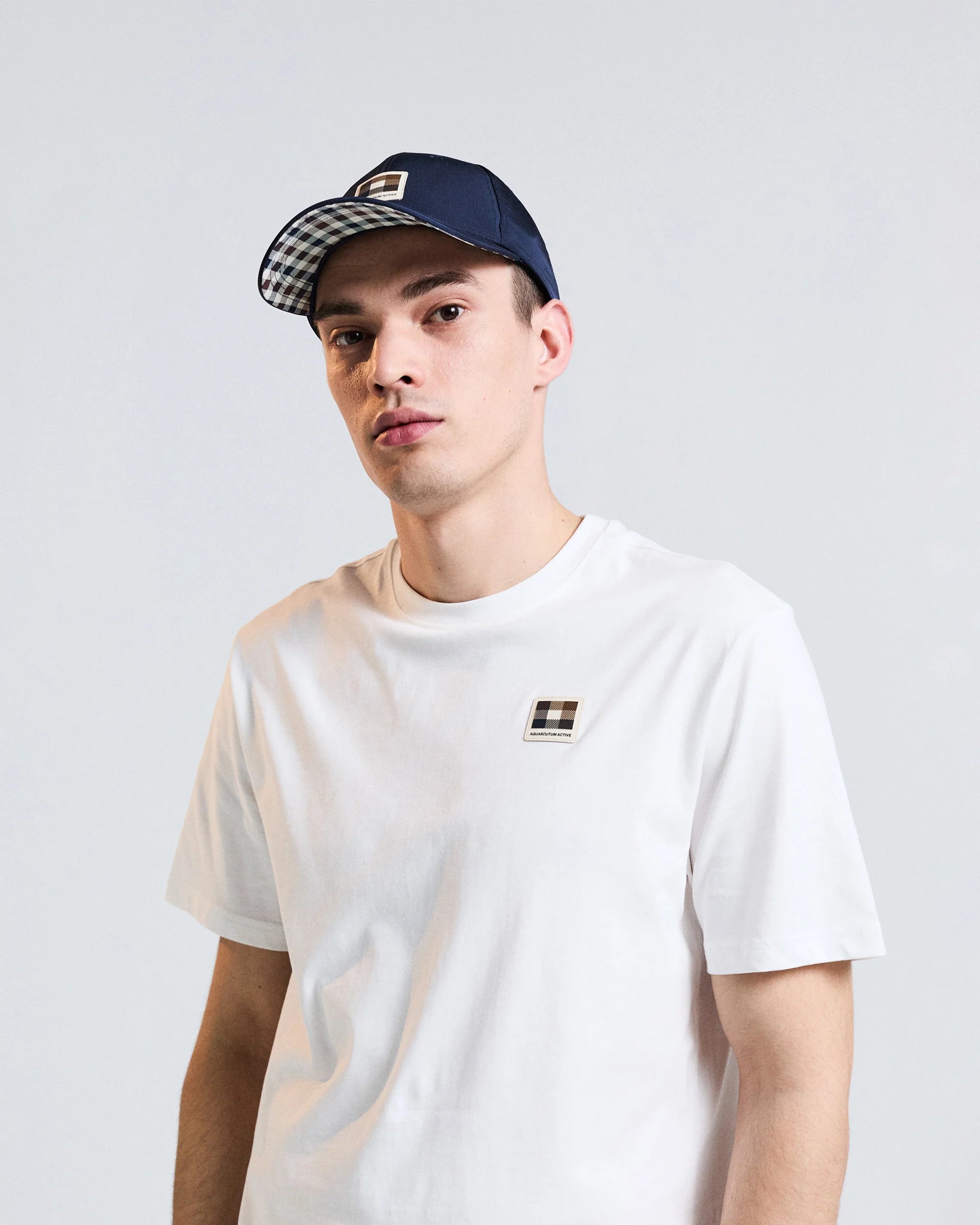 Navy Aquascutum Lamina Badge baseball cap with brand logo on front, made of cotton, casual men's accessory