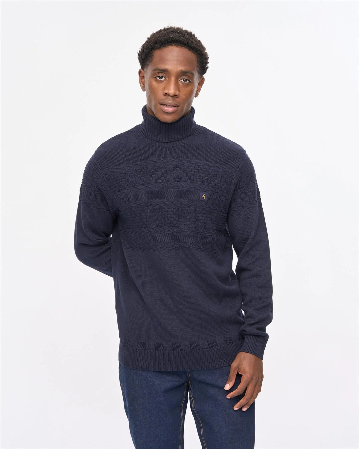 Gabicci Vintage Emilio navy long sleeve roll neck knit jumper displayed on a model with a close-up view of the knit texture.