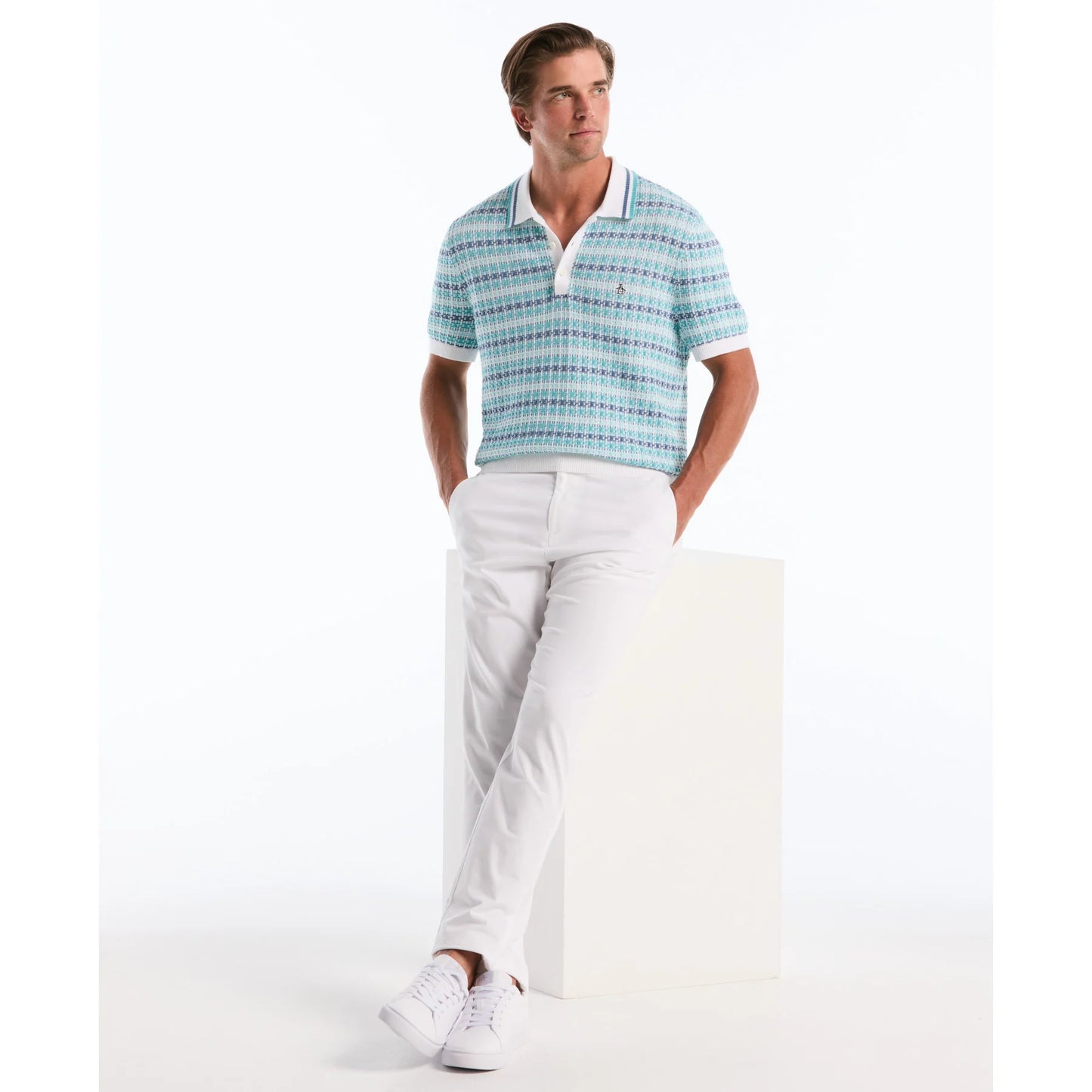 Original Penguin textured jacquard polo shirt in bright white, close-up view showing detailed knit pattern and classic collar.