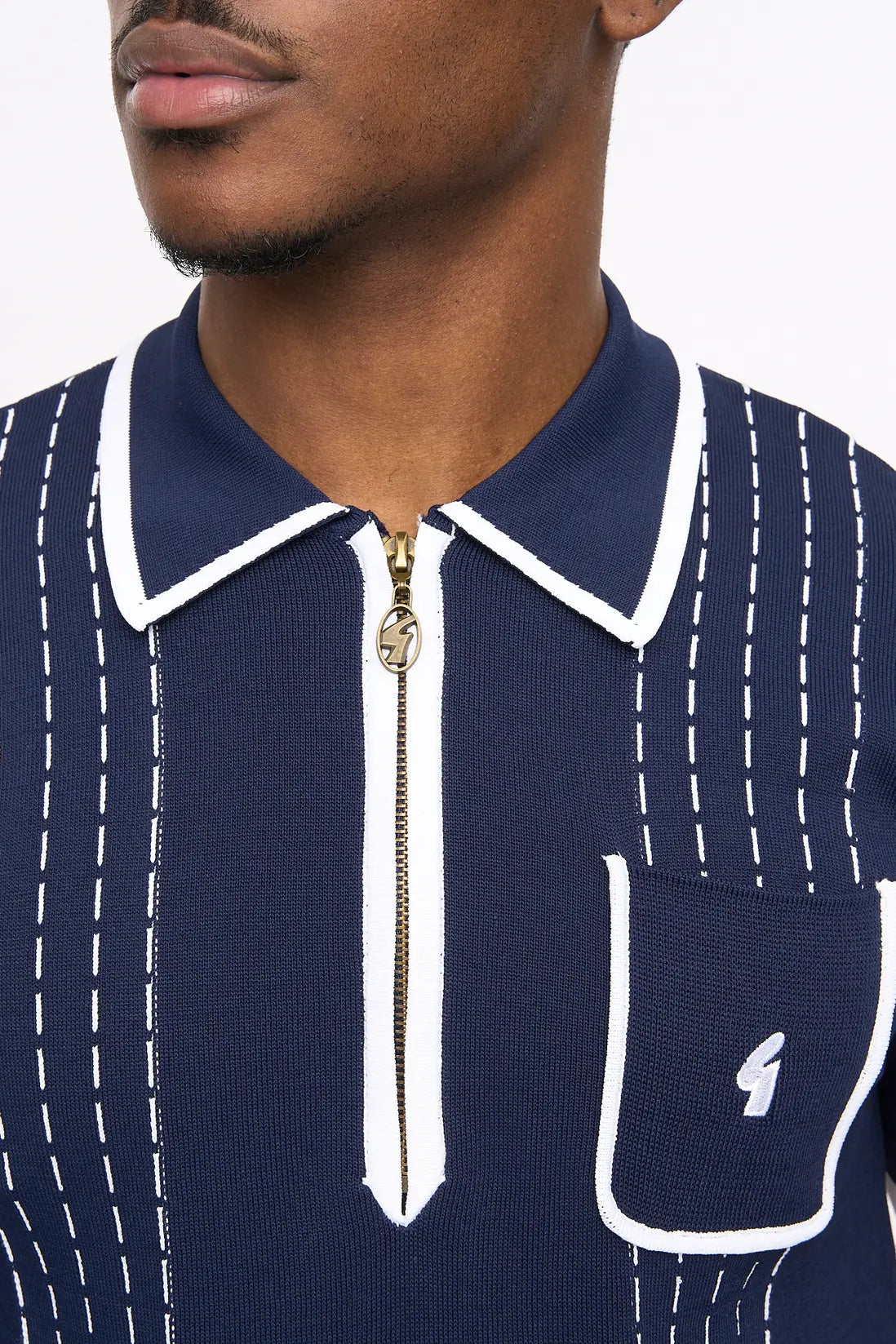 Navy Gabicci Vintage Darron knitted polo shirt, showcasing a classic knitwear design with a collar and button placket.