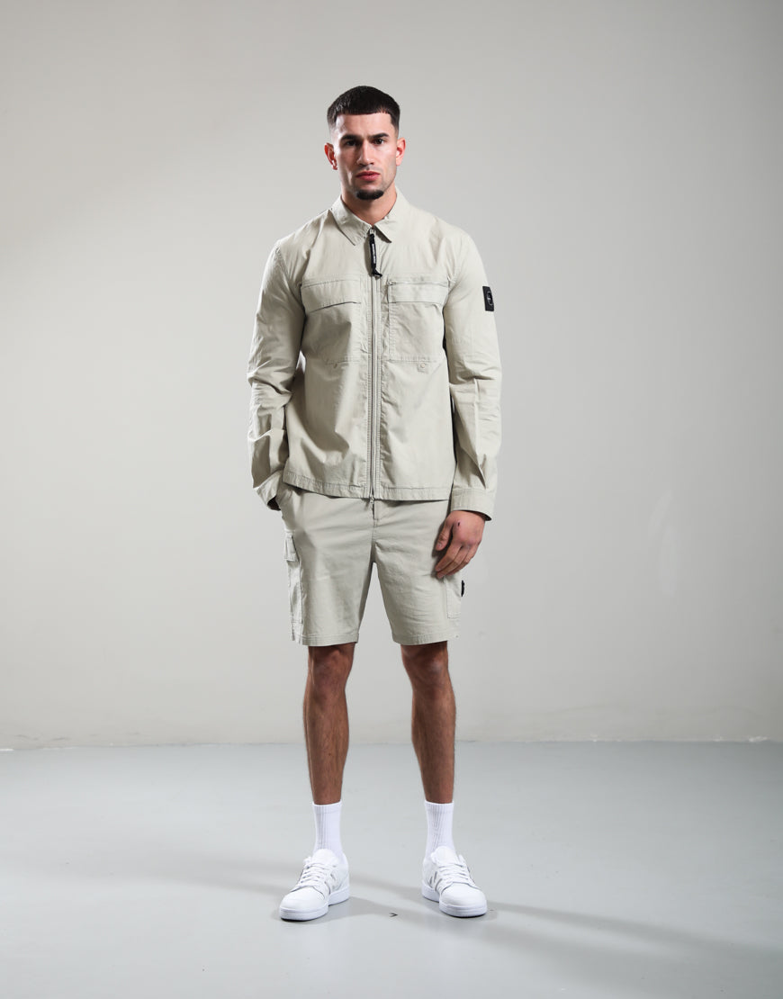 Marshall Artist Vanguard Overshirt in stone color, casual jacket with button-up front and chest pockets, suitable for layered styling.