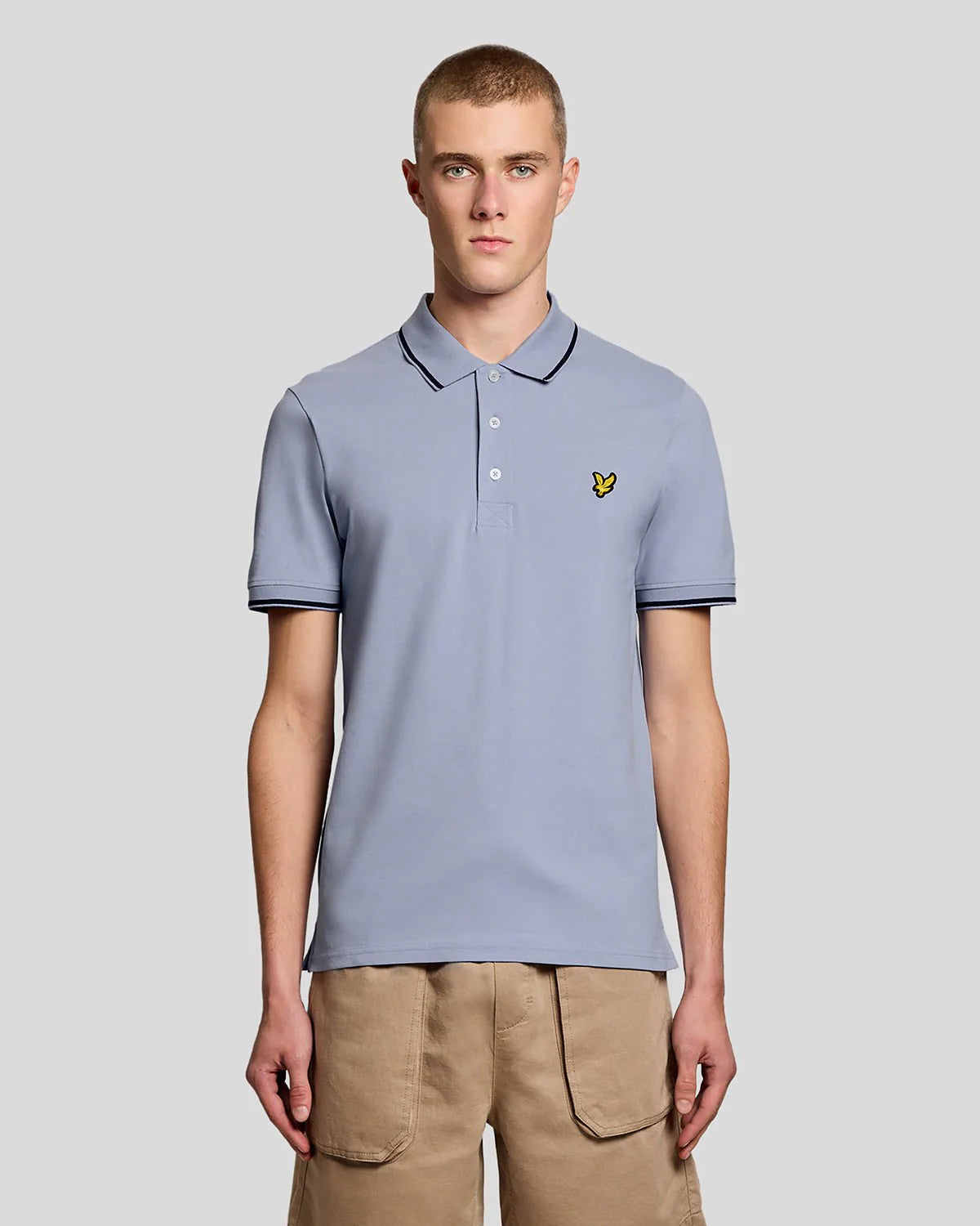 Lyle & Scott men's tipped polo shirt in Bubble Blue and Jet Black with contrasting collar and sleeve cuffs.