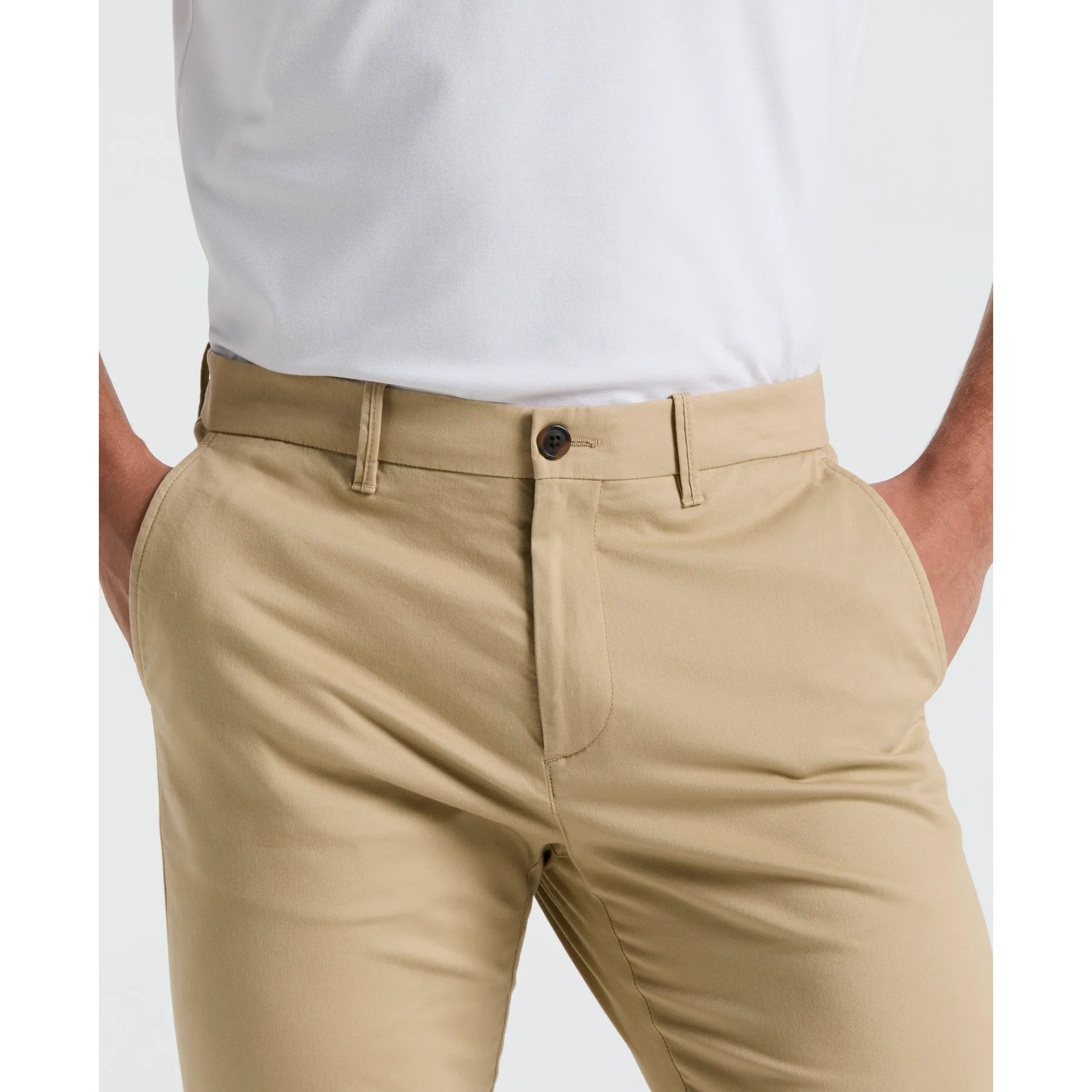 Original Penguin slim fit chinos in travertine color, showing the tailored trousers with front pockets and belt loops.