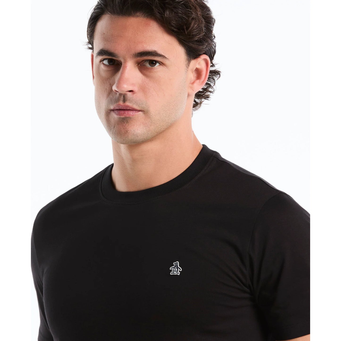 Black Original Penguin T-shirt featuring a Sticker Pete Logo design on the front, casual short-sleeve style.