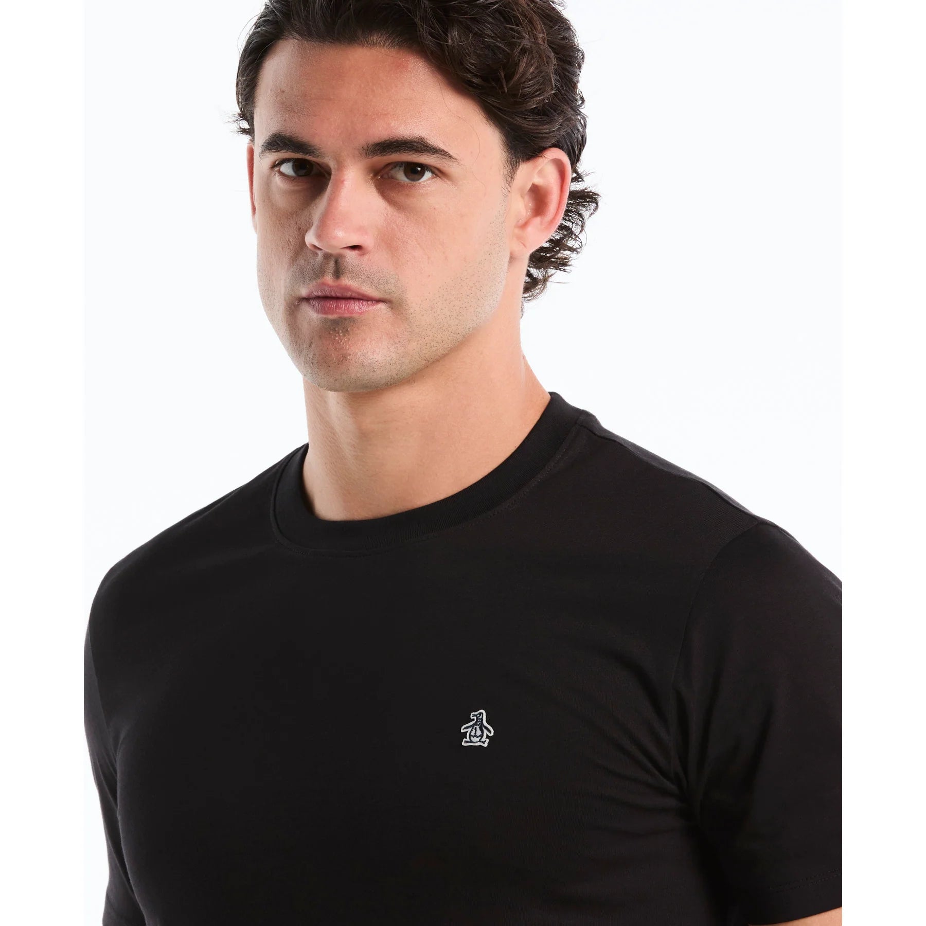 Black Original Penguin T-shirt featuring a Sticker Pete Logo design on the front, casual short-sleeve style.